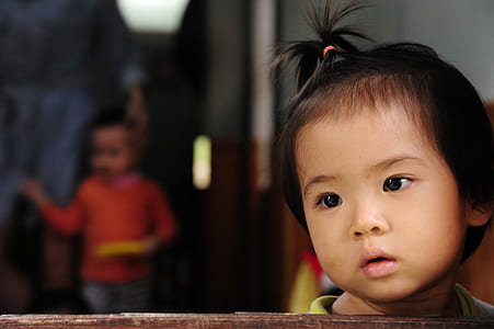 toddler leaning on rail thumbnail