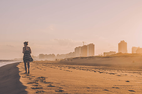 woman waling on beach thumbnail