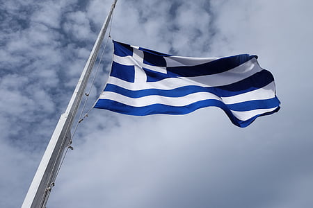 blue and white flag on pole thumbnail