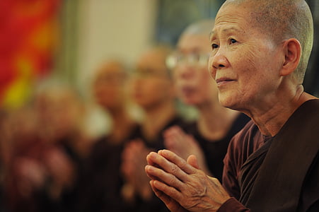 selective photo of monk wearing brown tops thumbnail