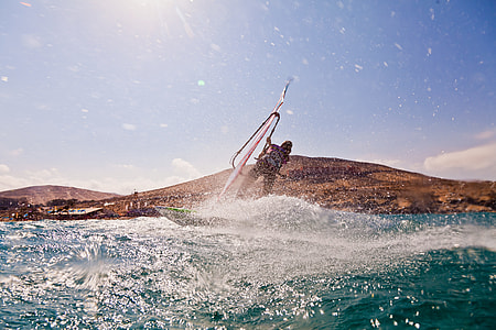 man riding on boat during daytime thumbnail