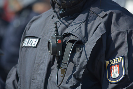 close-up photo of man wearing black top with lapel thumbnail