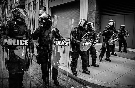 grayscale photo of group of police thumbnail