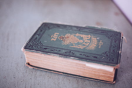 black and green hard-bound book thumbnail