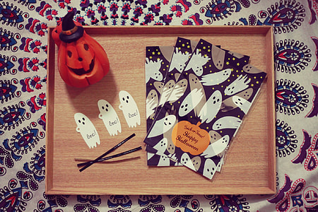 ghost printed cards and jack o lantern on brown wooden tray thumbnail