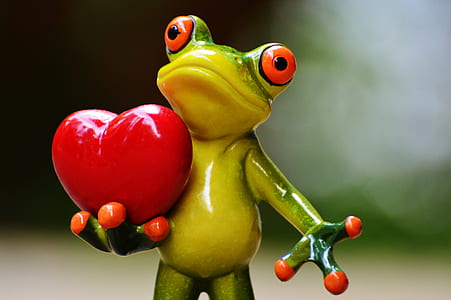 frog holding heart figurine thumbnail