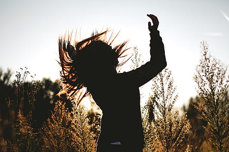 silhouette of woman waving her hair thumbnail