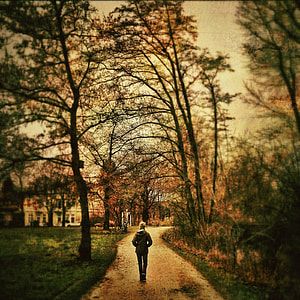 woman wearing jacket standing on pathway thumbnail