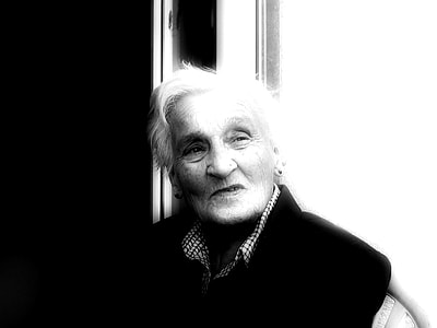 grayscale photography of woman wearing collared top thumbnail