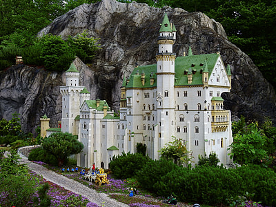 white and green castle at the back of mountain thumbnail