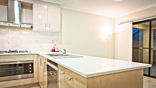 person taking a photo of kitchen set thumbnail