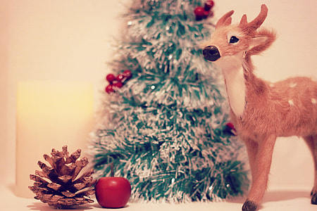 brown deer stand figure with green christmas tree and ceramic apple thumbnail