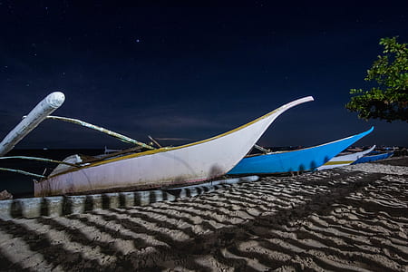 white and blue boats under blue sky thumbnail