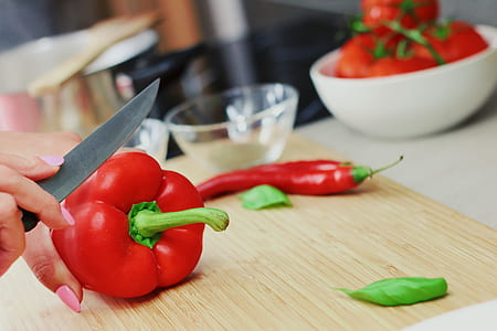 red bell pepper on beige cutting board thumbnail
