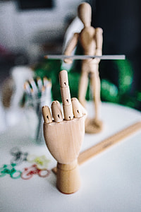 Wooden mannequin in various poses thumbnail
