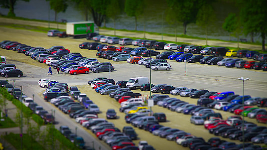 parked vehicles near green trees thumbnail