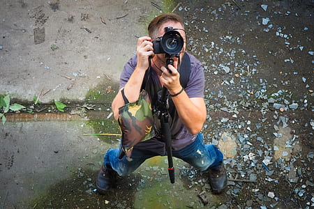 person looking up while taking photo during daytime thumbnail
