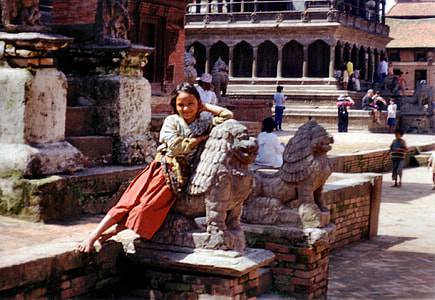 Girl Leaning on a statue in Kathmandu, Nepal thumbnail