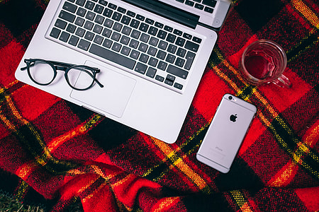 Apple Macbook on a red blanket thumbnail