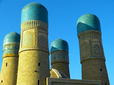 low angle photo of concrete tower under blue skies thumbnail