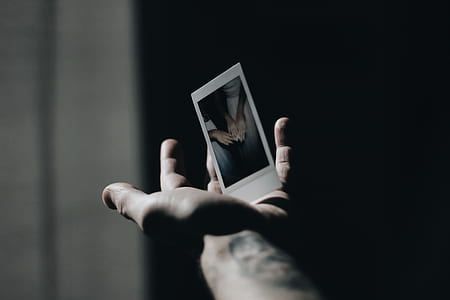 person holding insta photo thumbnail