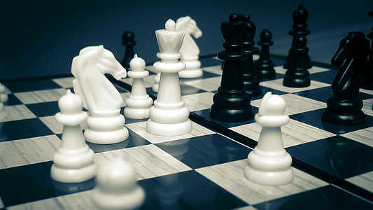 close-up photography of chess pieces on board thumbnail