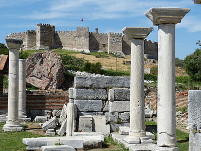 ruins near castle during daytime thumbnail