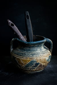 blue and brown clay jar with two ladles thumbnail