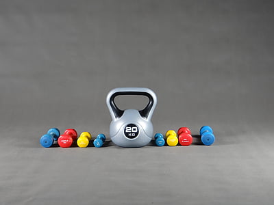 gray kettle bell and fixed weight dumbbells thumbnail