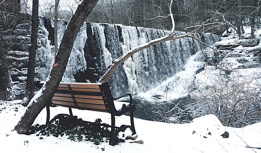 Snow Covered With Brown and Black Steel Couch thumbnail