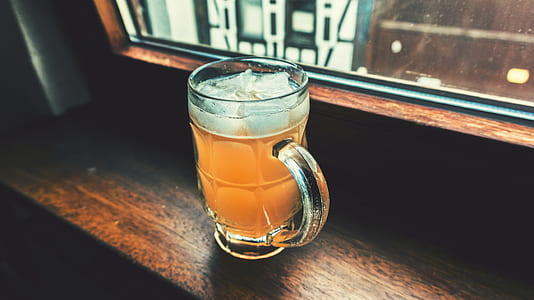 clear glass beer mug on window thumbnail
