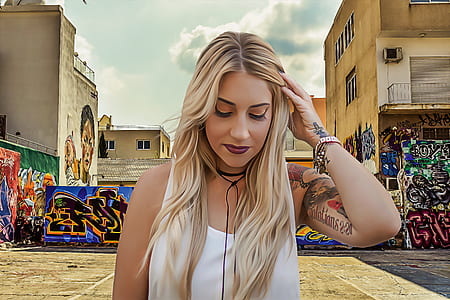 girl in white tops standing on road thumbnail
