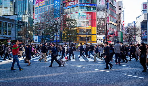 group of people walking on the city during daytime thumbnail