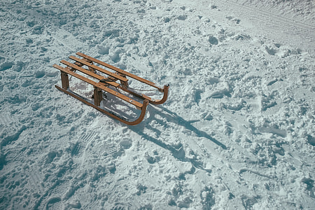 brown sled on snow thumbnail