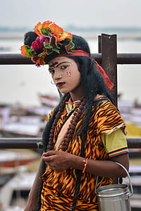 woman in floral dress with bucket on arm thumbnail