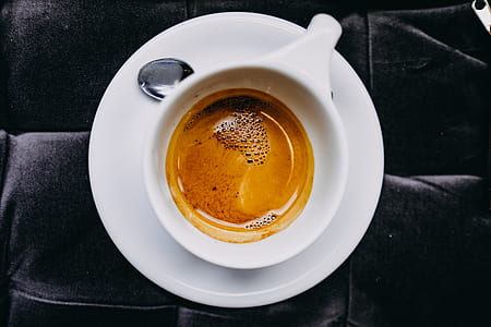 flat lay photography of cappuccino on top of saucer thumbnail