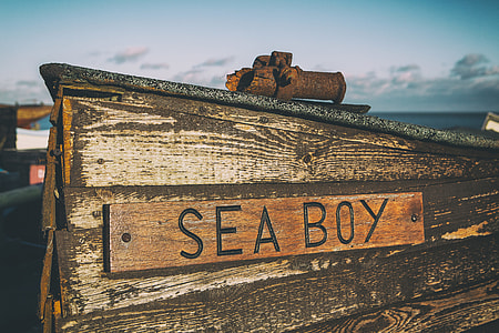 Wide angle shot of an old wooden fishing boat captured on the beach of Deal in Kent, England thumbnail