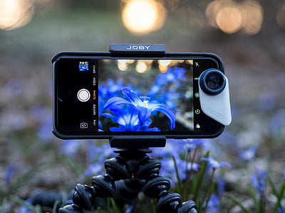 space gray iPhone 6 with black case mounted on tripod taking photo of flower thumbnail
