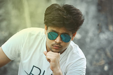 Man Wearing Blue Sunglasses With Black Frame thumbnail
