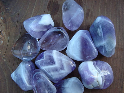 closeup photo of purple-and-white polished stones on brown surface thumbnail