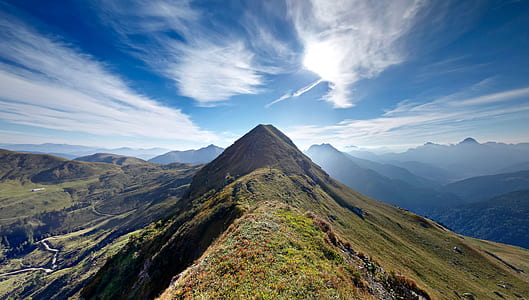photo of a green mountain during daytime thumbnail