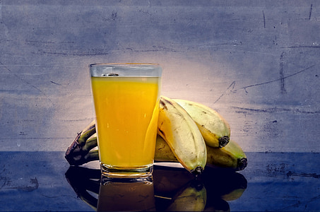 clear drinking glass besides banana thumbnail