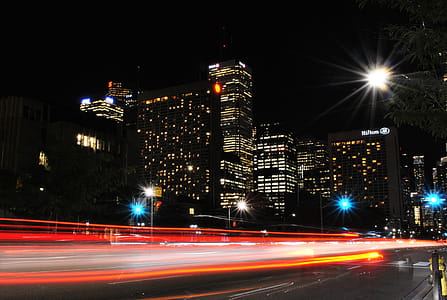 Time Lapse Photography of Red and Orange Taillight in City during Daytime thumbnail