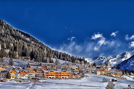 village covered with snow during daytime thumbnail