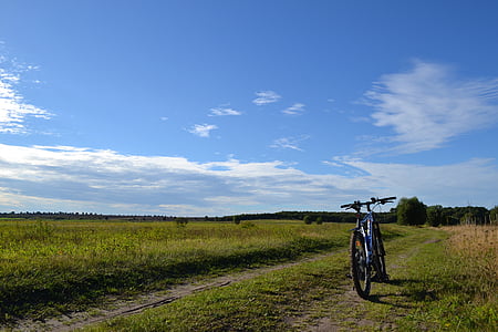 bicycle on green field thumbnail