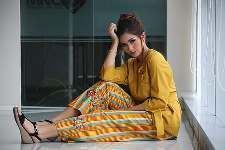 Woman Sitting On White Floor Tile thumbnail