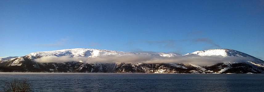 Landscape Photography of Mountain Near Body of Water thumbnail