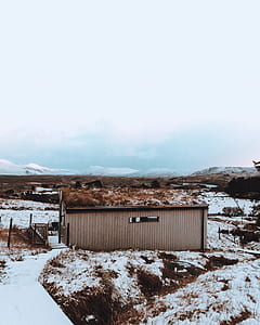 photo of house near snow coated ground thumbnail