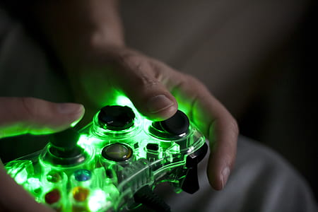 person holding Xbox 360 controller thumbnail