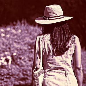gray scale photo of woman wearing white hat thumbnail